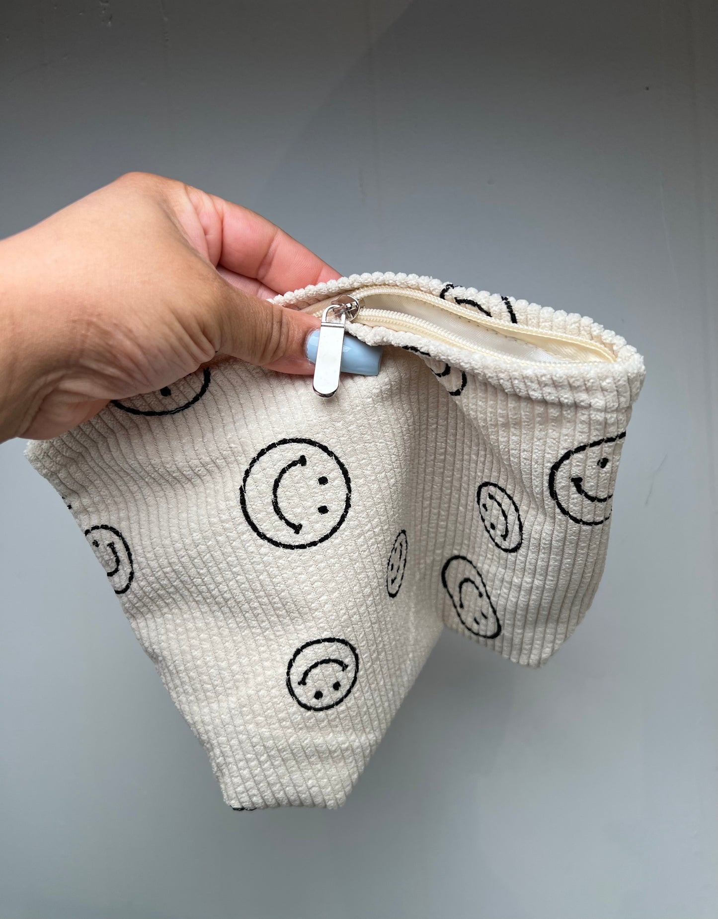 Corduroy smiley travel bag