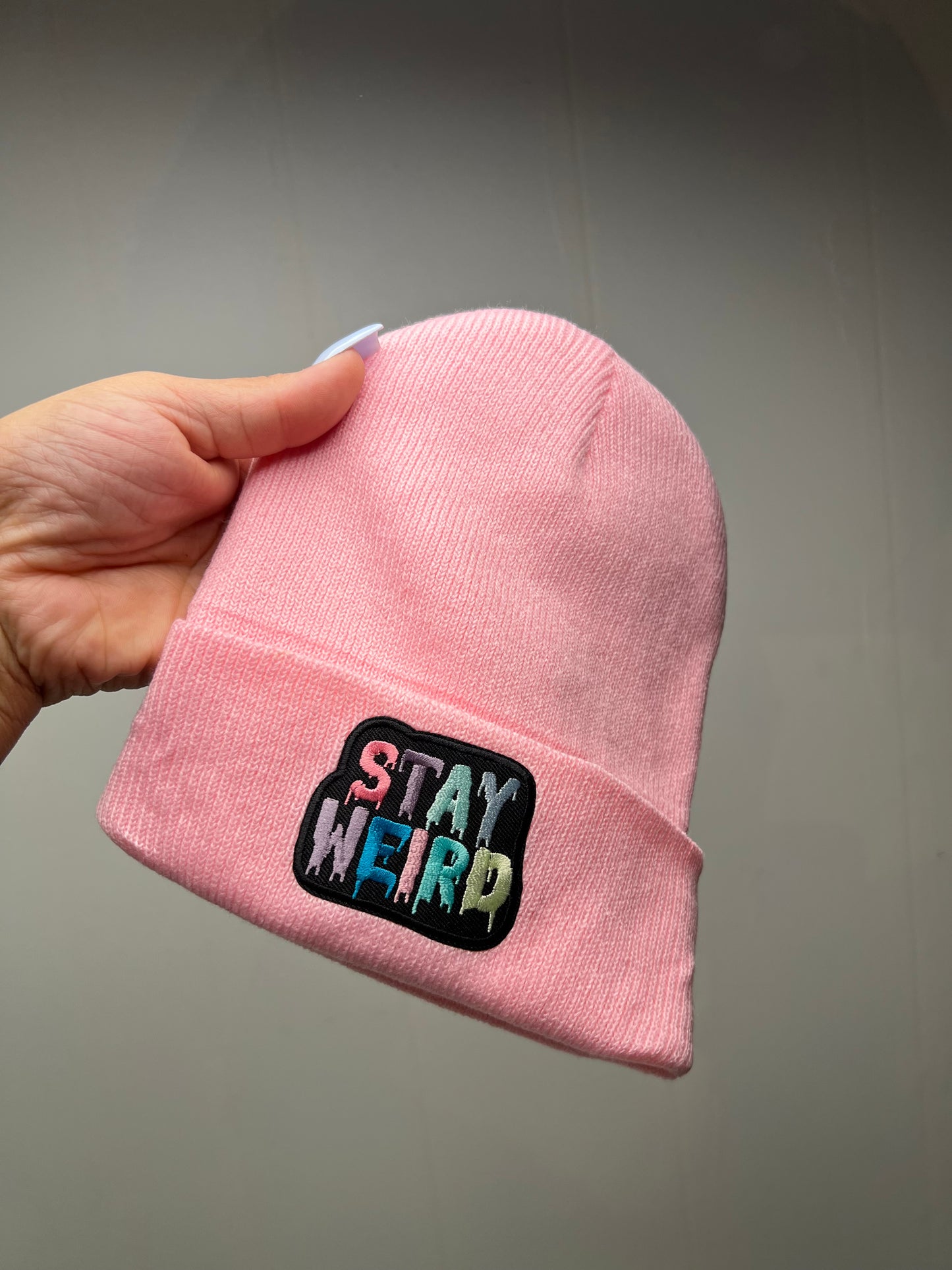 Stay weird pink beanie